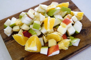 orange pear and apple prepared for a fresh and nutritious salad