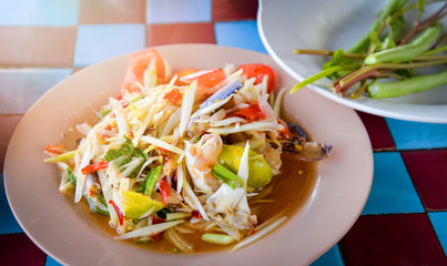Green papaya salad spicy ingredients papaya shredded savory garnish herb with crab
