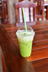 Iced green tea in plastic cup matcha green tea latte frappe and straw