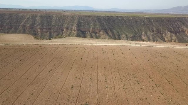 Aerial view of a big ravine on a desert area.