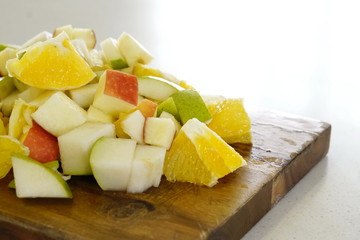 orange pear and apple prepared for a fresh and nutritious salad