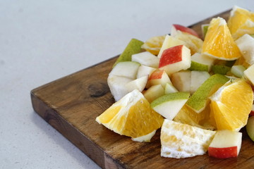 orange pear and apple prepared for a fresh and nutritious salad