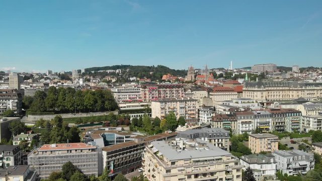 Aerial drone shot flying up and towards the Hotel Lausanne Palace while tilting down in Lausanne Switzerland