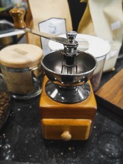 coffee grinder and cup of coffee