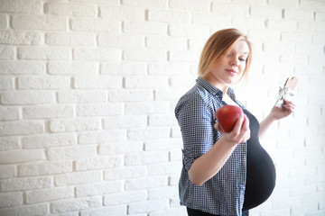 Pregnant young beautiful girl on the ninth month