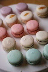 dozen of macaroons on white table