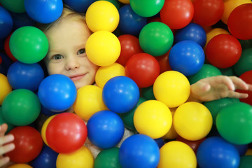 A small child is playing with toy