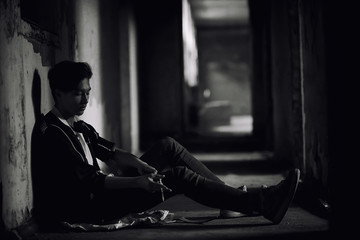 A young man takes drugs