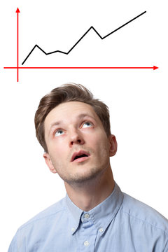 handsome brunette male with pensive expression, dressed in fashionable shirt, tries to remember something, isolated over white background with chart above