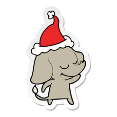 sticker cartoon of a smiling elephant wearing santa hat