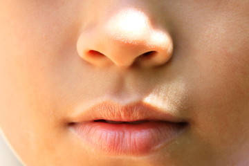 Obraz premium Close-up image of the real person's mouth.