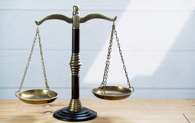 Law scales on table background. Symbol of justice