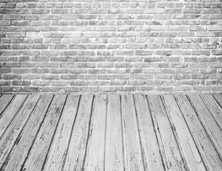 Grunge white brick wall with wooden floor