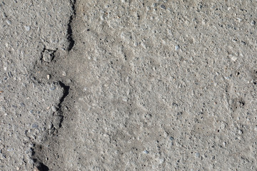 Texture of concrete. Asphalt background. Road surface. Texture of asphalt and stones on the road.