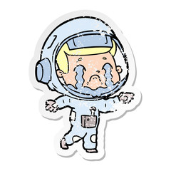 distressed sticker of a cartoon crying astronaut