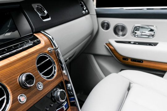 AC Ventilation Deck in Luxury modern car Interior. Modern car white leather interior. with stitchig. Natural wood. Perforated leather. Car detailing. Car inside