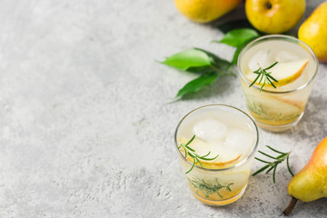 Lemongrass pear rosemary cocktails. Selective focus, space for text.