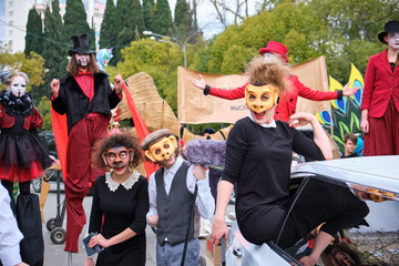 Sochi, Russia - 10 MAR 2019. Theater actors in masks monkeys perform on the street. The scenery of the movies. Street artists at the carnival.