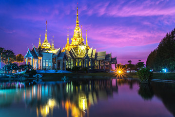 Fototapeta na wymiar beautiful temple thailand dramatic colorful sky twilight sunset shadow on water reflection with light