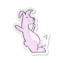 Obraz na płótnie Canvas retro distressed sticker of a cartoon pink bunny