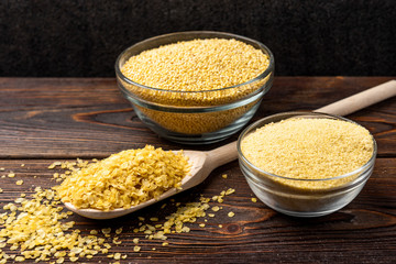 Millet on dark wooden background.