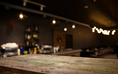 Beer barrel with beer glasses on a wooden table. The dark brown background.