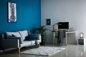 Interior of room with comfortable workplace