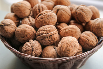 Tasty walnuts in bowl, closeup