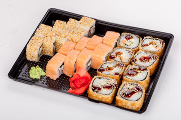 Japanese national popular cuisine. Sushi, rice and fish. Tasty, beautifully served food in a restaurant, cafe, with elements of the original design.