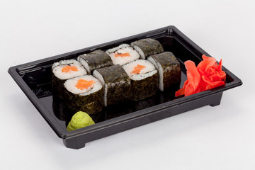 Japanese national popular cuisine. Sushi, rice and fish. Tasty, beautifully served food in a restaurant, cafe, with elements of the original design.