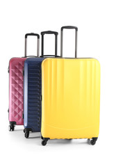 Packed suitcases on white background