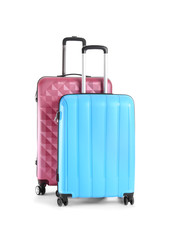 Packed suitcases on white background