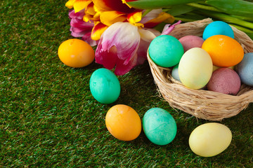 Fototapeta na wymiar Easter Eggs with flower on Green Grass