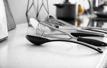 Clean utensils on counter in modern kitchen