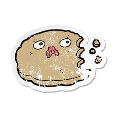 distressed sticker of a cartoon bitten cookie