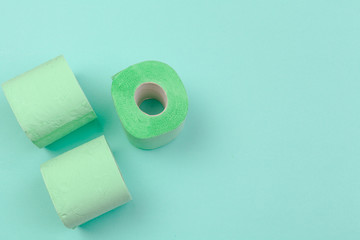 Roll of toilet paper on blue color background