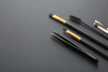 Set of tools for eyebrows correction on grey background
