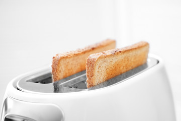Toaster with bread slices, closeup