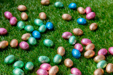 color Chocolate Easter eggs on a grass