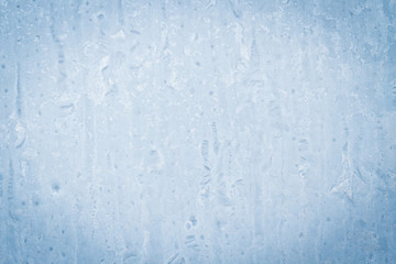 Fototapeta na wymiar Frosty patterns on a frozen ice box in the early morning
