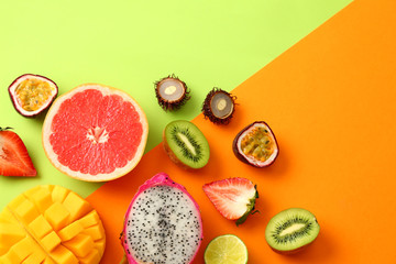 Assortment of exotic fruits on color background