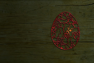 easter egg with ornaments on the textured background