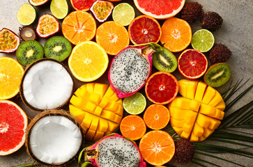 Assortment of exotic fruits on grey background