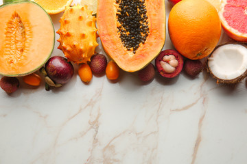 Assortment of tasty exotic fruits on light background