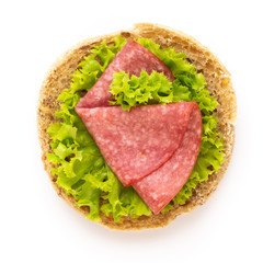 Sandwich with salami sausage on white background.