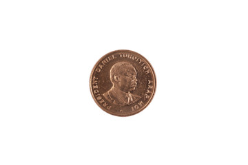 A close up image of a ten Kenyan cent coin isolated on a white background