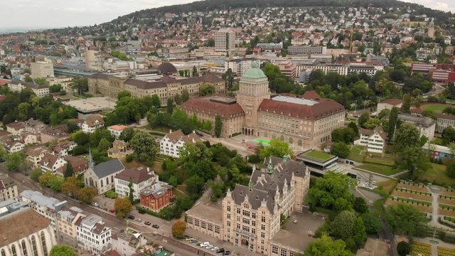 Aerial drone shot flying backwards above Z&uuml;rich Switzerland showing ETH and UZH