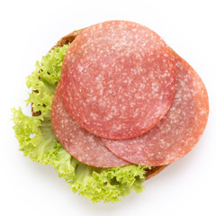 Sandwich with salami sausage on white background.