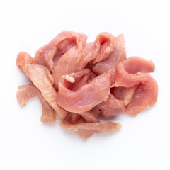 Raw chicken fillet. Small pieces of meat isolated on white.