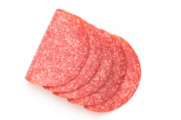 Salami slices on white background.